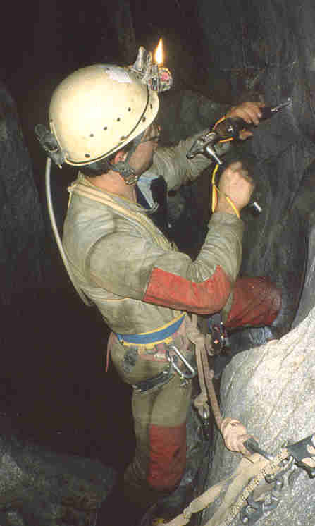 Koen, fixing a bolt before descending a pitch