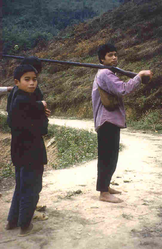 Little boys hunting with a museum piece